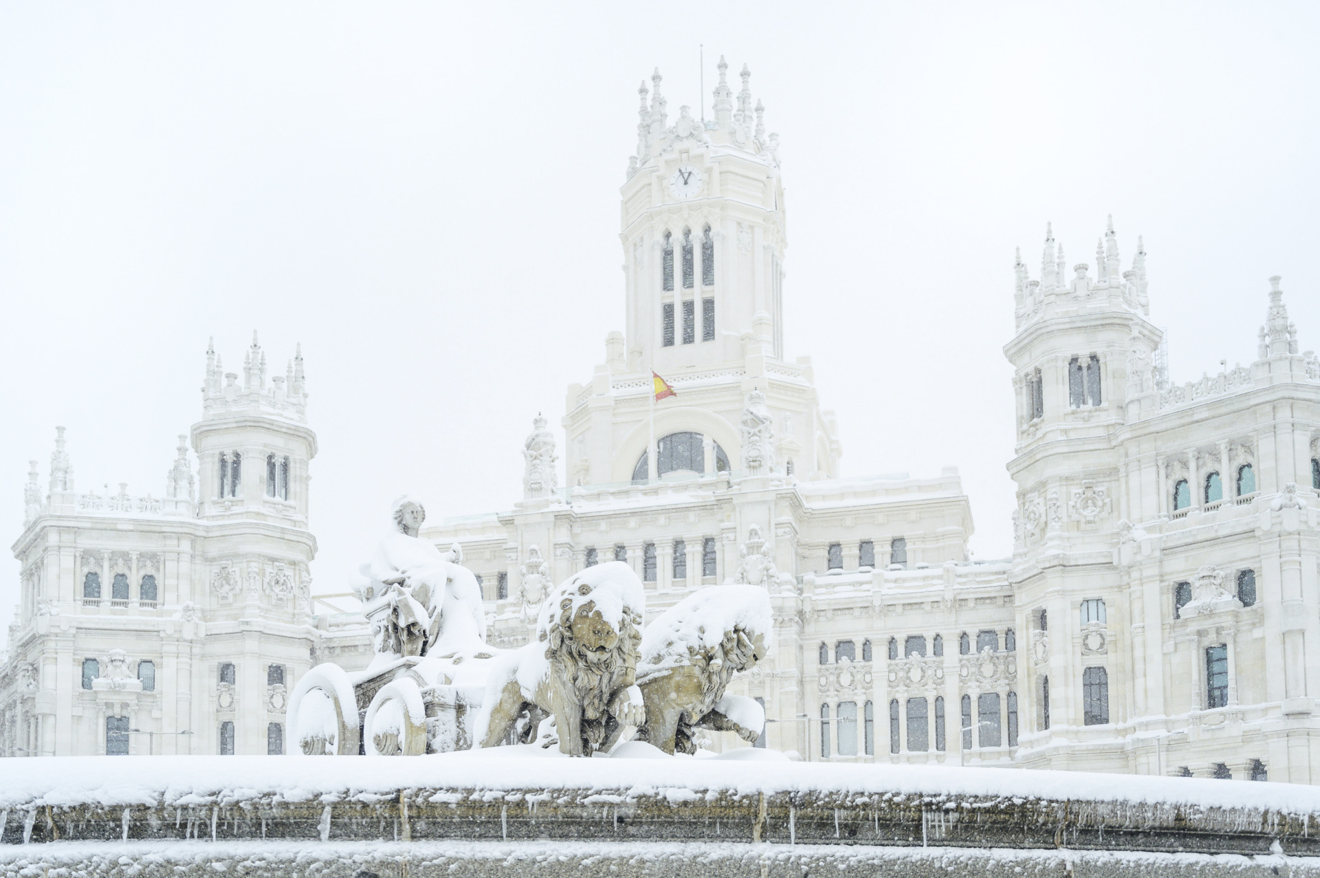 fountain of the plaza de cibeles in madrid covered 2026 01 07 06 23 57 utc